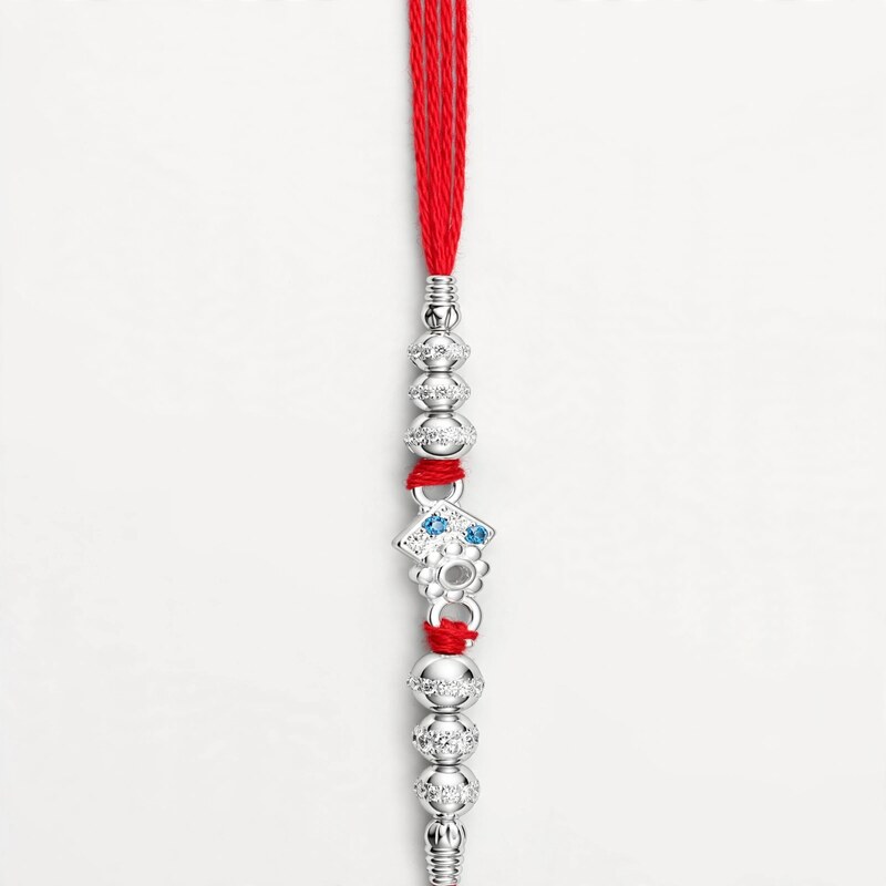 Silver Kite Motif Rakhi with Blue Stones
