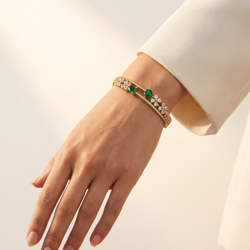 Gold-Tone Floral Bangle with Green Stones